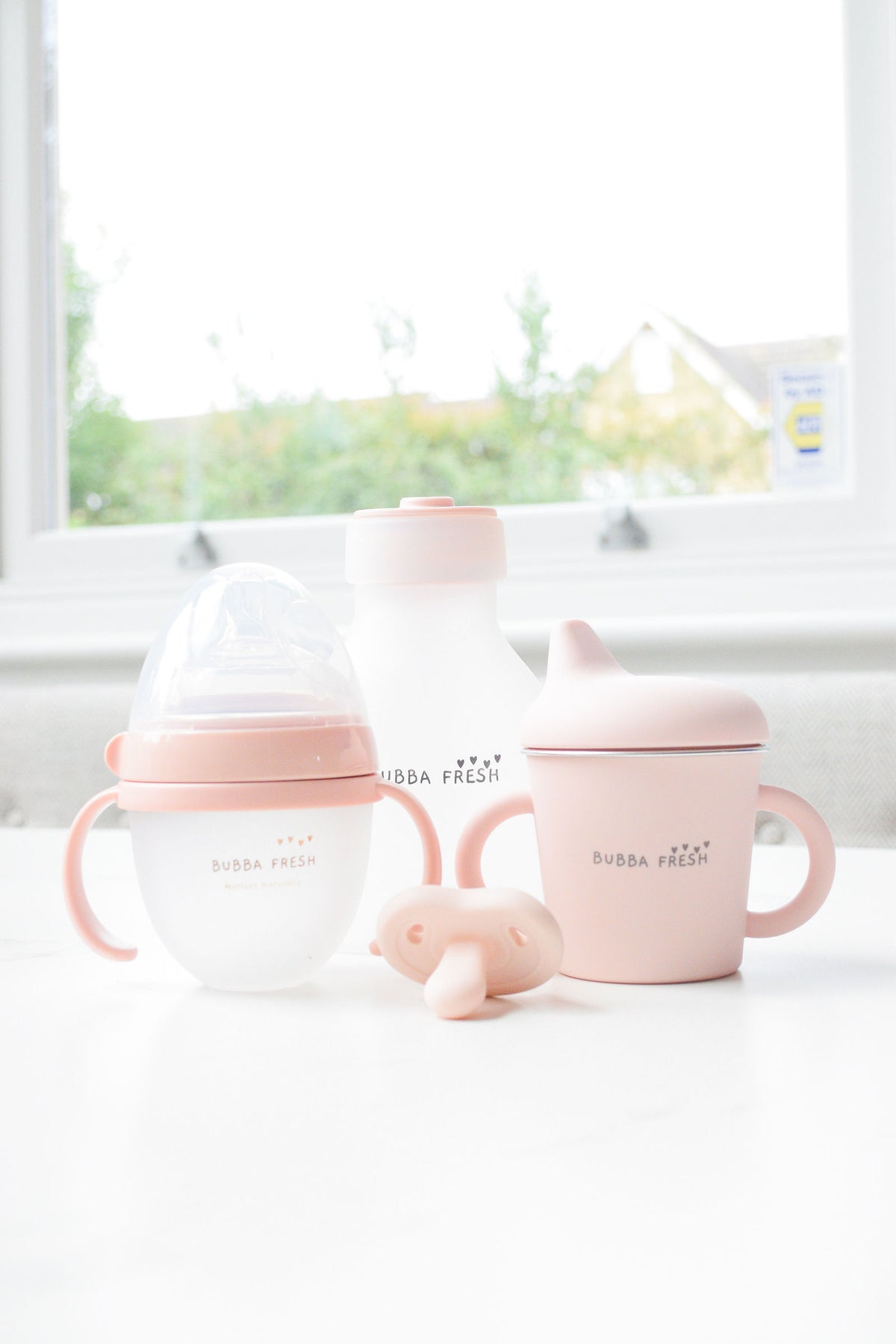 Bubba Fresh milk storage bottle on the kitchen windowsill